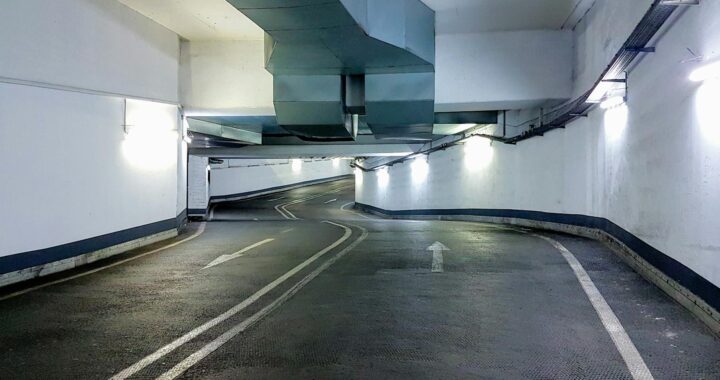 Interior view of a modern underground parking garage in Berlin, Germany. Well-lit and empty passage.