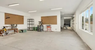 A bright and spacious industrial workshop with machinery and tools.